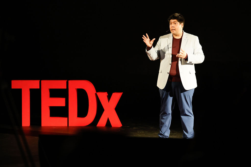 Camilo Zambrano on stage at TEDx